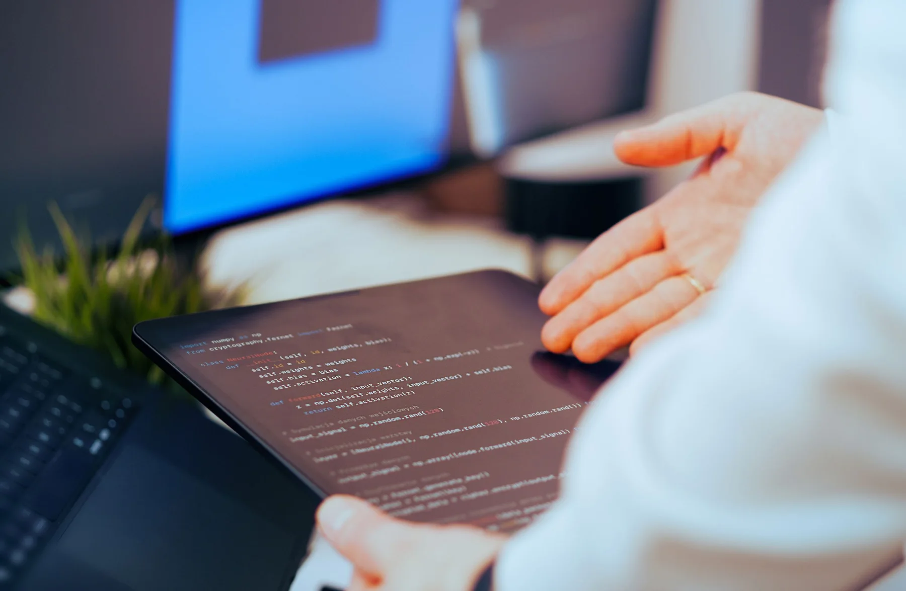 A developer inspects source code on a tablet.